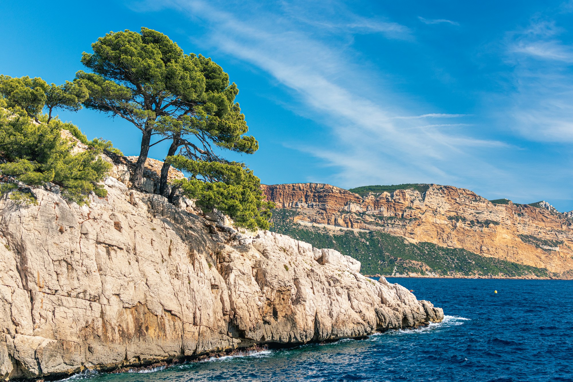 Rock ledge leading into Paris & The French Riviera water.