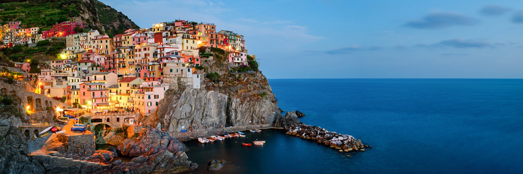 Cliff with buildings and boats